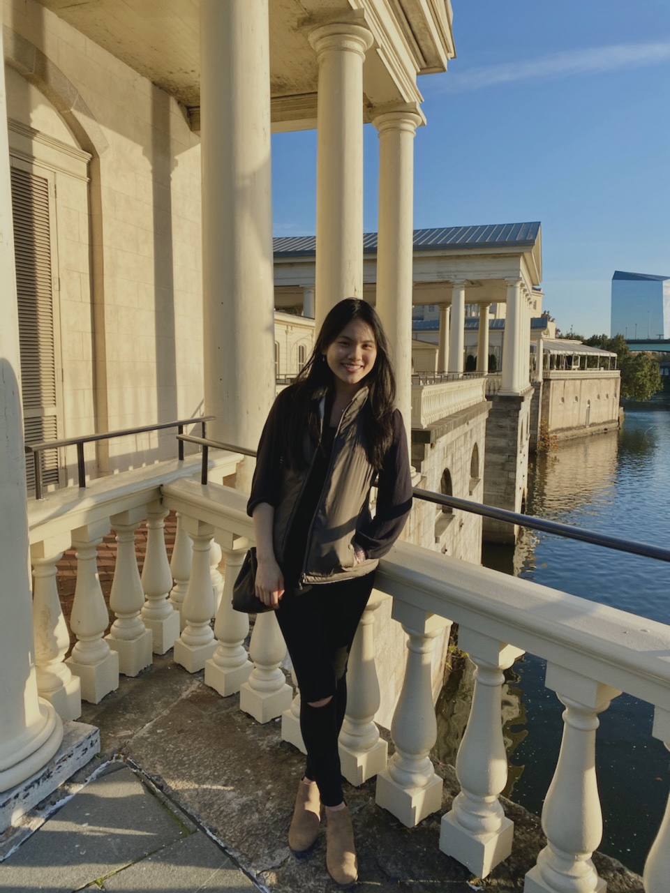 Amy Kwok, a Health Sciences student in the BS/DPT Bridge program standing in front of the Philadelphia Water Works